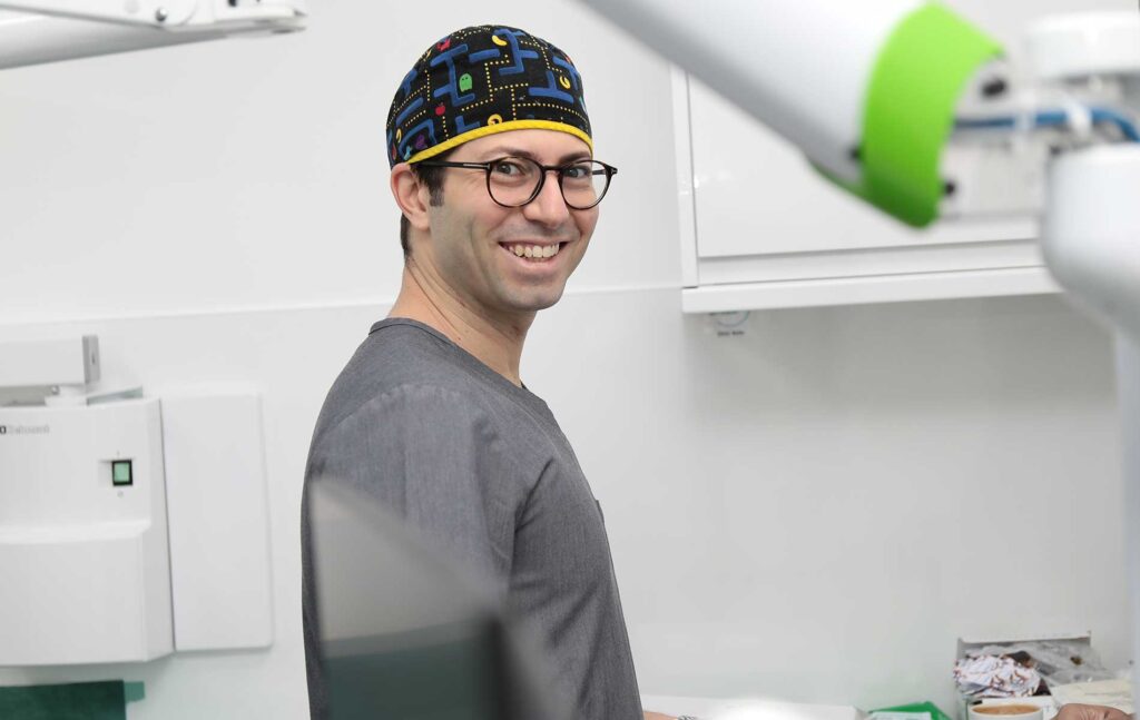Dr Eric Battista with the X-Guide system instead of freehand implant surgery