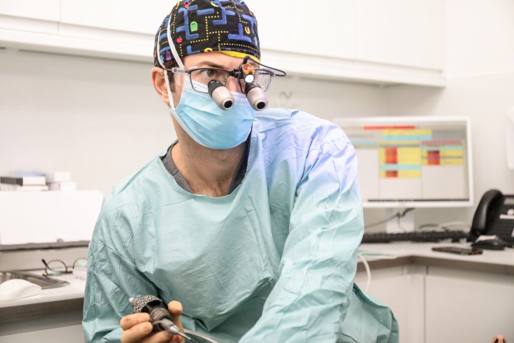 Dr Eric Battista operating with surgical loupes during a sinus lift