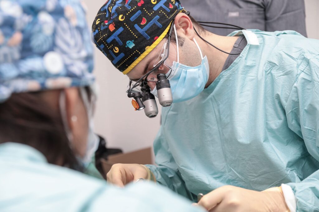 Dr Eric Battista performing minor oral surgery