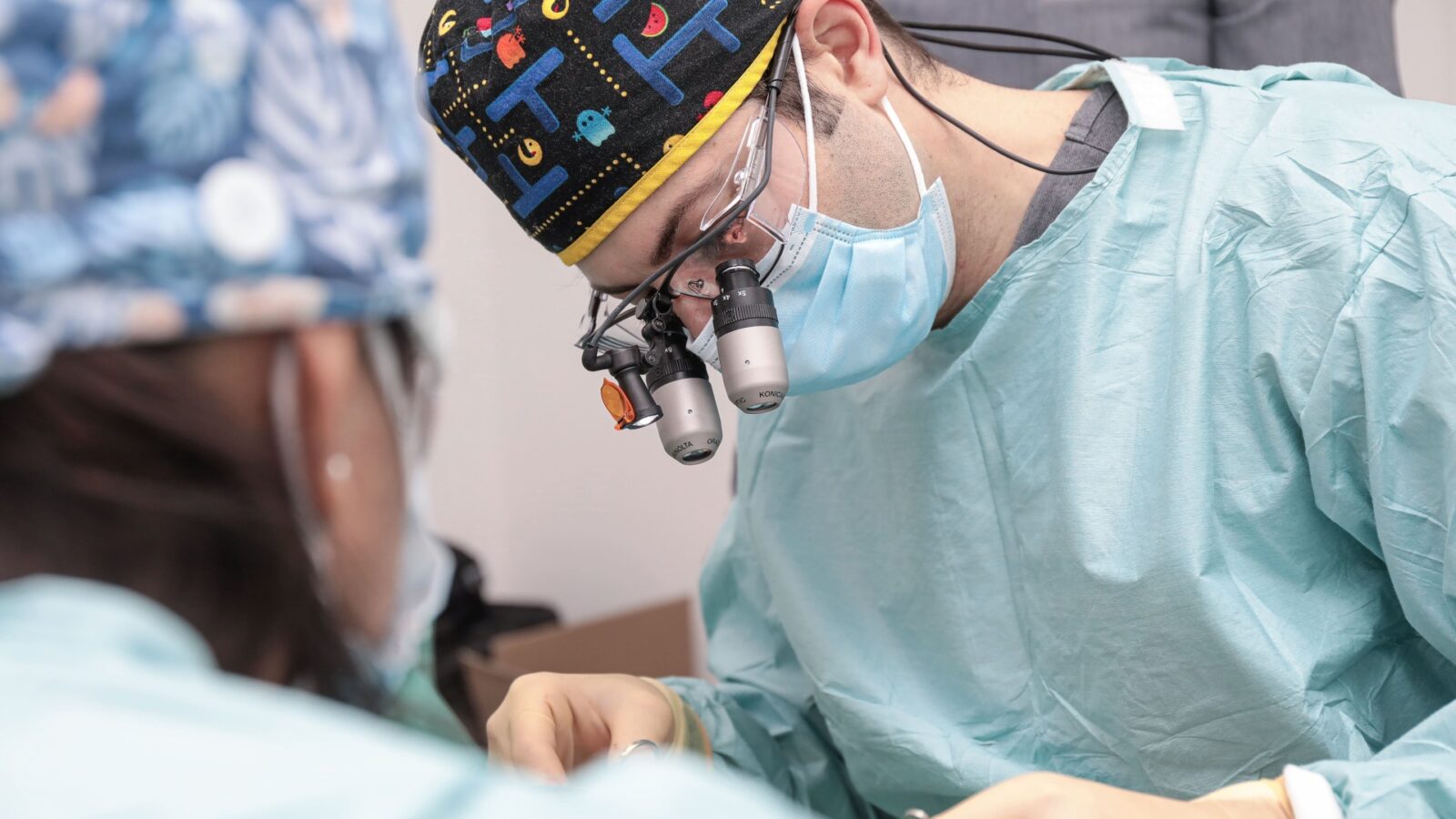 Dr Eric Battista operating with surgical loupes